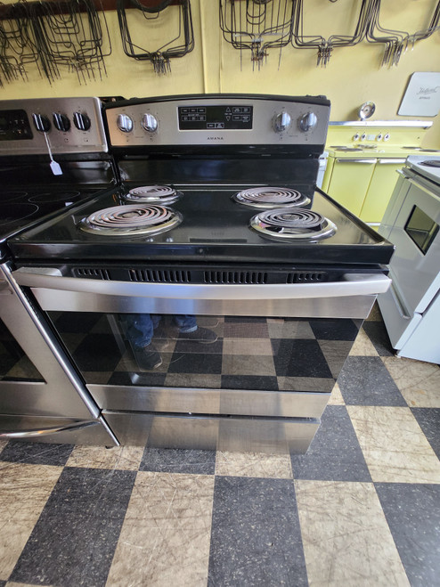 Amana 30 Inch Freestanding Electric Range with 4 Coil Burners, 4.8 cu. ft. Oven, Storage Drawer Bake Assist Pre-Set Temperatures, Easy Touch Electronic Controls, Temp Assure Cooking System, and Warm Hold: Stainless Steel SKU 20044
