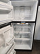 GE 18 CUBIC FOOT REFRIGERATOR TOP FREEZER GLASS SHELVES 1 FULL WIDTH 2 HALF SHELVES 2 CRISPER DRAYERS WIRE SHELF IN FREEZER UP FRONT CONTROLS SILVER LOCATED IN OUR PORTLAND OREGON APPLIANCE STORE SKU 20079