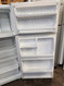 HOTPOINT 15 CUBIC FOOT REFRIGERATOR TOP FREEZER WIRE SHELVES LARGE SINGLE CRISPER FEW DINGS ON LOWER NEAR THE BOTTOM SEE PIC WHITE LOCATED IN OUR PORTLAND OREGON APPLIANCE STORE SKU 21052