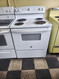 HOTPOINT 30 INCH FREESTANDING ELECTRIC RANGE COIL BURNERS 2 LARGE 2 SMALL MANUAL CLEAN OVEN STORAGE DRAWER WHITE LOCATED IN OUR PORTLAND OREGON APPLIANCE STORE SKU 22086