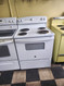 HOTPOINT 30 INCH FREESTANDING ELECTRIC RANGE COIL BURNERS 2 LARGE 2 SMALL MANUAL CLEAN OVEN STORAGE DRAWER WHITE LOCATED IN OUR PORTLAND OREGON APPLIANCE STORE SKU 22086