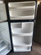 GE 18 CUBIC FOOT REFRIGERATOR TOP FREEZER WIRE SHELVES 2 CRISPER DRAWER FULL SIZE WIRE SHELF IN FREEZER BLACK LOCATED IN OUR PORTLAND OREGON APPLIANCE STORE SKU 23063