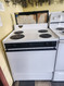 FRIGIDAIRE 30 INCH FREESTANDING WITH SMALL BACK PANEL ELECTRIC RANGE MANUAL CLEAN OVEN COIL BURNERS 3 SMALL 1 LARGE WHITE NO STORAGE DRAWER WHITE LOCATED IN OUR PORTLAND OREGON APPLIANCE STORE SKU 20068