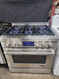 Jenn-Air 36" Stainless Steel Gas Range Dual-Fan Multi-Mode® True Convection System 5,000 BTU Simmer Burner Two 20,000 BTU Stacked Power Burners 7-Inch Full-Color Touch-Anywhere LCD Display SKU 23077