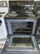 FRIGIDAIRE 30 INCH FREESTANDING ELECTRIC RANGE COIL BURNERS 2 LARGE 2 SMALL SELF CLEANING OVEN BLACK LOCATED IN OUR PORTLAND OREGON APPLIANCE STORE SKU 23110