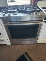 Jenn-Air Euro-Style Series 30 Inch Slide-In Dual Fuel Range with 4 Sealed Burners, 6.4 Cu. Ft. Capacity, Continuous Grates, Self-Clean, Downdraft Ventilation, True Convection 17000 BTU Burner COSMETIC ISSUE TOP OF OVEN DOOR STAINLESS SKU 23120