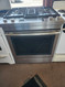 Jenn-Air Euro-Style Series 30 Inch Slide-In Dual Fuel Range with 4 Sealed Burners, 6.4 Cu. Ft. Capacity, Continuous Grates, Self-Clean, Downdraft Ventilation, True Convection 17000 BTU Burner COSMETIC ISSUE TOP OF OVEN DOOR STAINLESS SKU 23120