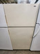 HOTPOINT 14 CUBIC FOOT REFRIGERATOR WIRE SHELVES 2 CRISPER DRAWERS COSMETIC ISSUES ON DOOR FEW DINGS ALMOND LOCATED IN OUR PORTLAND OREGON APPLIANCE STORE SKU 23154