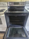 FRIGIDAIRE GALLERY 30 INCH FREESTANDING 5 BURNER GLASS TOP ELECTRIC RANGE QUICK PREHEAT CONVECTION SELF CLEANING OVEN BLACK AND STAINLESS LOCATED IN OUR PORTLAND OREGON APPLIANCE STORE SKU 23155