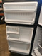 GE 16 CUBIC FOOT RERRIGERATOR GLASS SHELVES WITH 1 DELI PAN AND 2 CRISPER DRAWERS WIRE SHELF IN FREEZER BLACK LOCATED IN OUR PORTLAND OREGON APPLIANCE STORE SKU 23167