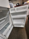 WHIRLPOOL 16 CUBIC FOOT REFRIGERATOR WIRE SHELVES 2 CRISPER DRAWERS GLASS COVER WIRE SHELF IN FREEZER WHITE LOCATED IN OUR PORTLAND OREGON APPLIANCE STORE SKU 23169
