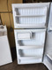 HOTPOINT16 CUBIC FOOT REFRIGERATOR TOP FREEZER WIRE SHELVES 2 CLEAR CRISPER DRAWERS WHITE LOCATED IN OUR PORTLAND OREGON APPLIANCE STORE SKU 23179