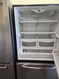 Amana 25.1 Cu. Ft. Easy Reach? Slide-Out Bottom Freezer Refrigerator w/ Built in Ice Maker: Stainless Steel w/ Black Cabinet: Right Hinge LOCATED IN OUR PORTLAND OREGON APPLIANCE STORE SKU 23200