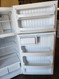 HOTPOINT 16 CUBIC FOOT TOP FREEZER ADJUSTABLE WIRE SHELVES 2 CRISPER DRAWERS WIRE SHELF IN FREEZER WHITE LOCATED IN OUR PORTLAND OREGON APPLIANCE STORE SKU 23202