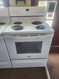 WHIRLPOOL 30 INCH FREESTANDING ELECTRIC RANGE COIL BURNERS 2 LARGE 2 SMALL KEEP WARM OPTION SELF CLEANING OVEN WHITE LOCATED IN OUR PORTLAND OREGON APPLIANCE STORE SKU 23207