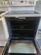 GE 30 INCH FREESTANDING GLASS TOP RANGE 4 BURNER 2 LARGE DUAL 2 SMALL HI/LO BROIL OPTION SELF CLEANING OVEN WHITE LOCATED IN OUR PORTLAND OREGON APPLIANCE STORE SKU 23216
