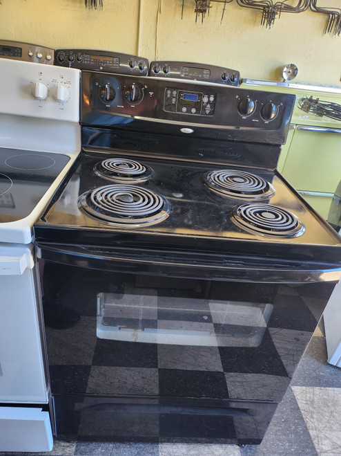 WHIRLPOOL 30 INCH FREESTANDING ELECTRIC RANGE COIL BURNERS 2 LARGE 2 SMALL MANUAL CLEAN OVEN BLACK LOCATED IN OUR PORTLAND OREGON APPLIANCE STORE SKU 23232
