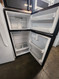 GE 17 CUBIC FOOT REFRIGERATOR TOP FREEZER ADJUSTABLE WIRE SHELVES 2 CRISPER DRAWERS FULL WIDTH SHELF IN FREEZER BLACK LOCATED IN OUR PORTLAND OREGON APPLIANCE STORE SKU 23242