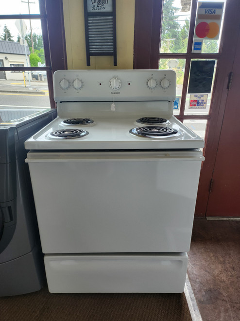 HOTPOINT 30 INCH FREESTANDING ELECTRIC RANGE MANUAL CLEAN OVEN COIL BURNERS 2LARGE 2 SMALL STORAGE DRAWER WHITE LOCATED IN OUR PORTLAND OREGON APPLIANCE STORE SKU 23252