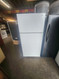 HOTPOINT 14 CUBIC FOOT REFRIGERATOR TOP FREEZER WIRE SHELVES 2 CRISPER DRAWERS COSMETIC ISSUES ON TOP OF REFRIGERATOR DOOR WHITE LOCATED IN OUR PORTLAND OREGON APPLIANCE STORE SKU 23256