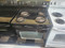 GE 30 INCH FREESTANDING ELECTRIC RANGE COIL BURNERS 2 LARGE 2 SMALL SELF CLEANING OVEN HI LO BROIL SETTING STORAGE DRAWER BLACK LOCATED IN OUR PORTLAND OREGON APPLIANCE STORE SKU 23275
