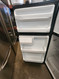 GE 17 CUBIC FOOT REFRIGERATOR WITH ADJUSTABLE WIRE SHELVES 2 CRISPER DRAWERS FILL WIDTH WIRE SHELF IN FREEZER BLACK LOCATED IN OUR PORTLAND OREGON APPLIANCE STORE SKU 23277