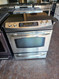 GE 30 INCH SLIDE-IN ELECTRIC RANGE SMOOTH TOP 5 BURNER 1 LARGE TRIPLE BURNER CENTER WARNER BURNER STAINLESS LOCATED IN OUR PORTLAND OREGON APPLIANCE STORE SKU 23285