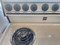 MAGIC CHEF 30 INCH FREESTANDING ELECTRIC RANGE MANUAL CLEAN OVEN COIL BURNERS 3 SMALL 1 LARGE ALMOND LOCATED IN OUR PORTLAND OREGON APPLIANCE STORE SKU 23287