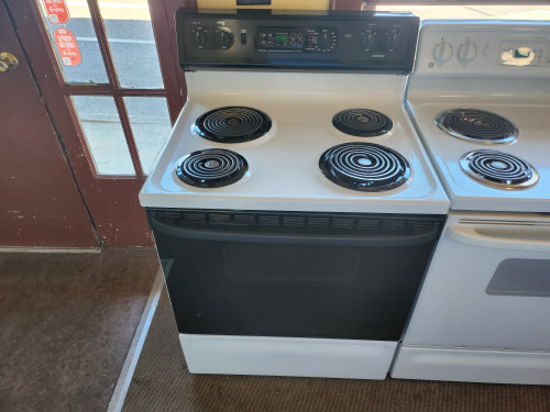 HOTPOINT 30 INCH FREESTANDING ELECTRIC RANGE COIL BURNERS 2 LARGE 2 SMALL SELF CLEANING OVEN WHITE WITH  BLACK GLASS DOOR AND CONTROL PANEL LOCATED IN OUR PORTLAND OREGON APPLIANCE STORE SKU 23297