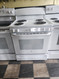 GE 30 INCH FREESTANDING ELECTRIC RANGE FRONT CONTROLS MANUAL CLEAN OVEN COIL BURNES 2 LARGE 2 SMALL WHITE LOCATED IN OUR PORTLAND OREGON APPLIANCE STORE SKU 23301