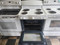 GE 30 INCH FREESTANDING ELECTRIC RANGE FRONT CONTROLS MANUAL CLEAN OVEN COIL BURNES 2 LARGE 2 SMALL WHITE LOCATED IN OUR PORTLAND OREGON APPLIANCE STORE SKU 23301