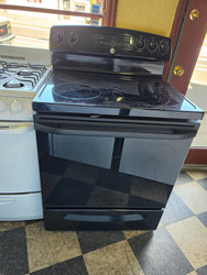 GE 30 INCH FREESTANDING 5 BURNER GLASS TOP RANGE 1 EXTRA LARGE DUAL 1 LARGE DUAL 2 SMALL CENTER WARNING BURNER HI/LO BROIL OPTION SELF CLEANING OVEN BLACK LOCATED IN OUR PORTLAND OREGON APPLIANCE STORE SKU 23341