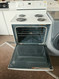 WHIRLPOOL 30 INCH FREESTANDING ELECTRIC RANGE COIL BURNERS 2 LARGE 2 SMALL SELF CLEANING OVEN CUSTOM BROIL OPTION STORAGE DRAWER GLASS DOOR NO WINDOW WHITE LOCATED IN OUR PORTLAND OREGON APPLIANCE STORE SKU 23444