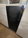 WHIRLPOOL 18 CUBIC FOOT REFRIGERATOR TOP FREEZER 4 SPLIT ADJUSTABLE GLASS SHELVES 1 DELI AND 2 CRISPER DRAWERS FULL WIDTH WIRE SHELF IN FREEZER BLACK LOCATED IN OUR PORTLAND OREGON APPLIANCE STORE SKU 23354