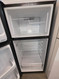 WHIRLPOOL 18 CUBIC FOOT REFRIGERATOR TOP FREEZER 4 SPLIT ADJUSTABLE GLASS SHELVES 1 DELI AND 2 CRISPER DRAWERS FULL WIDTH WIRE SHELF IN FREEZER BLACK LOCATED IN OUR PORTLAND OREGON APPLIANCE STORE SKU 23354