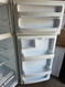 GE 28 Inch Top-Freezer Refrigerator with 17.5 cu. ft. Capacity, 2 Adjustable Spillproof Glass Shelves, Gallon Door Storage, Spillproof Freezer Floor, Air Tower, Upfront Temperature Controls and White SKU 23357