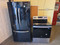 KITCHENAID FRENCH DOOR REFRIGERATOR 22 CUBIC FOOT AND WHIRLPOOL STOVE PACKAGE REFRIGERATOR ICE AND WATER GLASS SHELVES 2 CRISPER DRAWER DELI DRAWER 5 BURNER MANUAL CLEAN OVER BLACK SKU 23359
