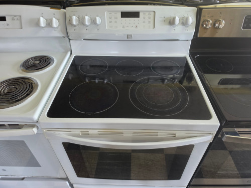 KENMORE 30 INCH FREESTANDING 5 BURNER GLASS RANGE 1 TRIPLE BURNER 1 LARGE 2 SMALL CENTER WARMING BURNER CONVECTION SELF CLEANING OVEN WARMING DRAWER WHITE LOCATED IN OUR PORTLAND OREGON APPLIANCE STORE SKU 23364