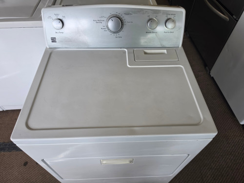 KENMORE 3 CYCLE GAS DRYER 1 TIMED 1 AUTO PLUS AIR DRY 3 TEMPERATURE PLUS WRINKLE GUARD TOP FILTER PULL DOWN HAMPER DOOR WHITE LOCATED IN OUR PORTLAND OREGON APPLIANCE STORE SKU 23375