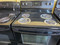 FRIGIDAIRE 30 INCH FREESTANDING ELECTRIC RANGE SELF COIL BURNERS 2 LARGE 2 SMALL BLACK WITH SILVER SORAGE DRAWER COSMETIC ISSUES WORKS GOOD LOCATED IN OUR PORTLAND OREGON APPLIANCE STORE SKU 23389