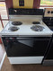 HOTPOINT 30 INCH FREESTANDING ELECTRIC RANGE COIL BURNERS 2 LARGE 2 SMALL SELF CLEANING OVEN BLACK GLASS DOOR NO WINDOW WHITE LOCATED IN OUR PORTLAND OREGON APPLIANCE STORE SKU 23403