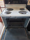 HOTPOINT 30 INCH FREESTANDING ELECTRIC RANGE COIL BURNERS 2 LARGE 2 SMALL SELF CLEANING OVEN BLACK GLASS DOOR NO WINDOW WHITE LOCATED IN OUR PORTLAND OREGON APPLIANCE STORE SKU 23403