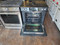 JENN-AIR 30 INCH SLIDE IN GLASS TOP RANGE 4 BURNER RAPID PREHEAT CONVECTION SELF CLEANING OVEN BLACK LOCATED IN OUR PORTLAND OREGON APPLIANCE STORE SKU 23408