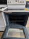 WHIRLPOOL 30 INCH FREESTANDING GLASS TOP ELECTRIC RANGE 4 BURNERS 1 LARGE DUAL 1 LARGE 2 SMALL MANUAL CLEAN OVEN STORAGE DRAWER WHITE LOCATED IN OUR PORTLAND OREGON APPLIANCE STORE SKU 23422