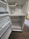 GE 14 CUBIC FOOT POCKET DOOR REFRIGERATOR TOP FREEZER WIRE SHELVES 2 CRISPER DRAWERS WHITE LOCATED IN OUR PORTLAND OREGON APPLIANCE STORE SKU 23854
