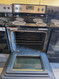WHIRLPOOL 30 INCH FREESTANDING ELECTRIC RANGE KEEP WARM OPTION SELF CLEANING OVEN DELAY START TIME SLAINLESS BLACK LOCATED IN OUR PORTLAND OREGON APPLIANCE STORE SKU 23866