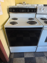 HOTPOINT 30 INCH ELECTRIC FREESTANDING MANUAL CLEAN COIL BURNERS 3 SMALL 1 LARGE WHITE WITH BLACK GLASS DOOR WITH WINDOW LOCATED IN OUR PORTLAND OREGON APPLIANCE STORE SKU 23888
