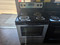 WHIRLPOOL 30 INCH FREESTANDING ELECTRIC RANGE SELF CLEANING OVEN COIL BURNERS 2 SMALL 2 LARGE KEEP WARM OPTION STAINLESS AND BLACK LOCATED IN OUR PORTLAND OREGON APPLIANCE STORE SKU 23895