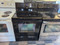 WHIRLPOOL 30 INCH FREESTANDING GLASS TOP RANGE 4 BURNER 1 LARGE DUAL 1 LARGE 2 SMALL SELF CLEANING OVEN KEEP WARM OPTION BLACK LOCATED IN OUR PORTLAND OREGON APPLIANCE STORE SKU 23898