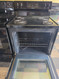 FRIGIDAIRE 30 INCH ELECTRIC RANGE COIL BURNERS 2 LARGE 2 SMALL SELF CLEANING OVEN BLACK AND STAINLESS LOCATED IN OUR PORTLAND OREGON APPLIANCE STORE SKU 23900